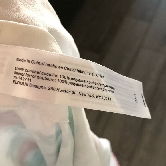 Eloquii|White chiffon floral halter jumpsuit with wide leg, open leg detail•••22 - Picture 14 of 17